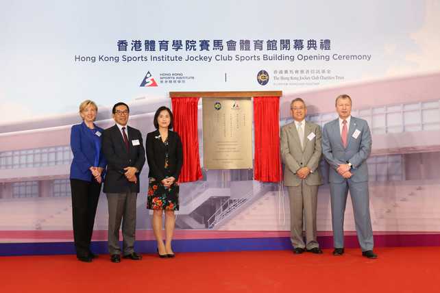 Mrs Betty Fung Ching Suk-yee JP, Permanent Secretary for Home Affairs (3rd left); Mr Anthony W K Chow SBS JP, Deputy Chairman of The Hong Kong Jockey Club (HKJC) (2nd right); Mr Carlson Tong Ka-shing SBS JP, Chairman of the HKSI (2nd left); Mr Winfried Engelbrecht-Bresges JP, Chief Executive Officer of The HKJC (1st right); and Dr Trisha Leahy BBS, Chief Executive of the HKSI (1st left), take photo together after unveiling the plaque to officially open the Jockey Club Sports Building.